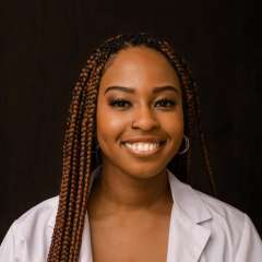Dr. Angela Udongwo smiling at the camera