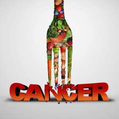 A conceptual image shows a large fork, filled with fruits and vegetables, breaking the red, 3D text "CANCER."