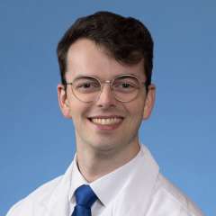 A headshot of John Miggins, MD