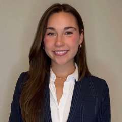 Head shot of Victoria Van Kirk, MD in business attire, smiling at camera.