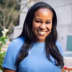 Dr. Folasade P. May wearing a blue shirt outside