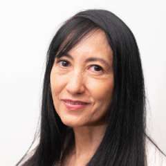 headshot of Dr. Quynh Pham in white blazer