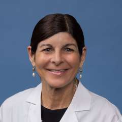 Holly R. Middlekauff, MD headshot wearing white lab coat and pearl earrings
